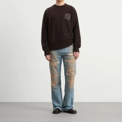 AMIRI Repaired Boot Cut Jeans