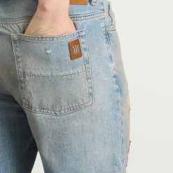 AMIRI Repaired Boot Cut Jeans